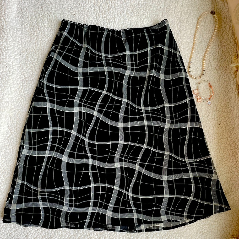 This skirts has flair and in a good condition no stain and rips